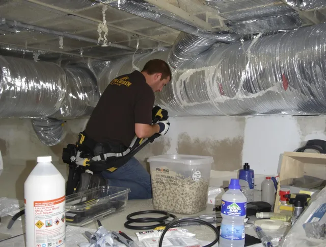 Westport Air Duct Cleaning specialist performing professional mold removal from air ducts in Westport
