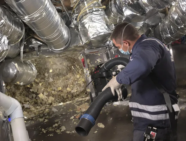 Westport Air Duct Cleaning specialist operating negative pressure cleaning equipment for thorough duct maintenance in Westport