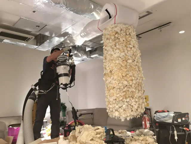 Westport Air Duct Cleaning technician performing precision vacuum insulation removal in a residential property in Westport