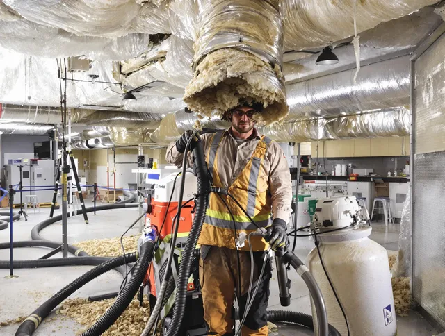 Professional vacuum insulation removal by Westport Air Duct Cleaning expert in Westport